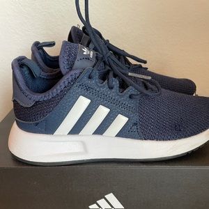 Navy and white Adidas sneakers in great condition.